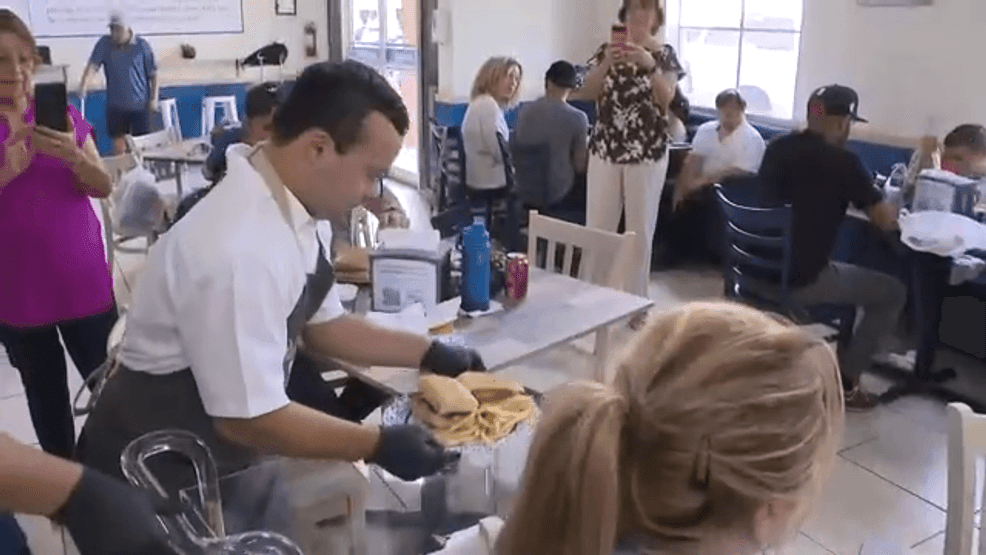 Adults with special needs working at No Limits Coffee café in Miami, Florida