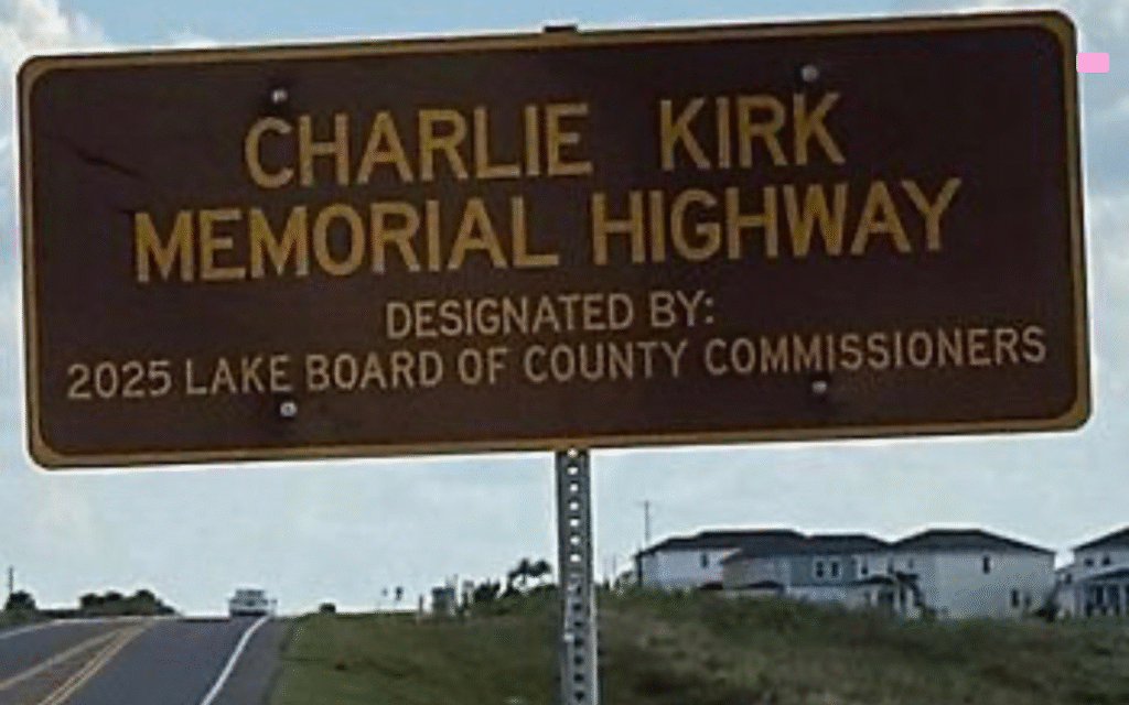 Charlie Kirk Memorial Highway brown sign on Schofield Road, Clermont, Florida