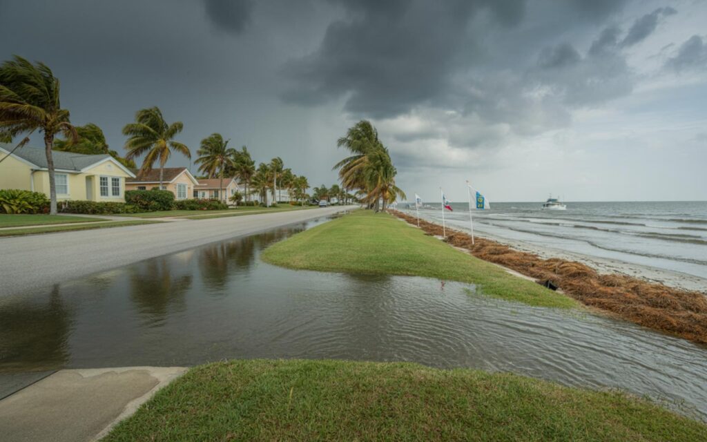 Scattered storms over South Florida coastline with coastal flooding and rough ocean waves