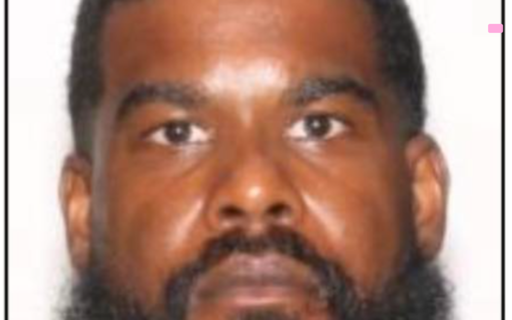 Police handcuffing Port St Lucie homicide suspect Sheldon Brian Morrison after arrest in Hollywood Florida