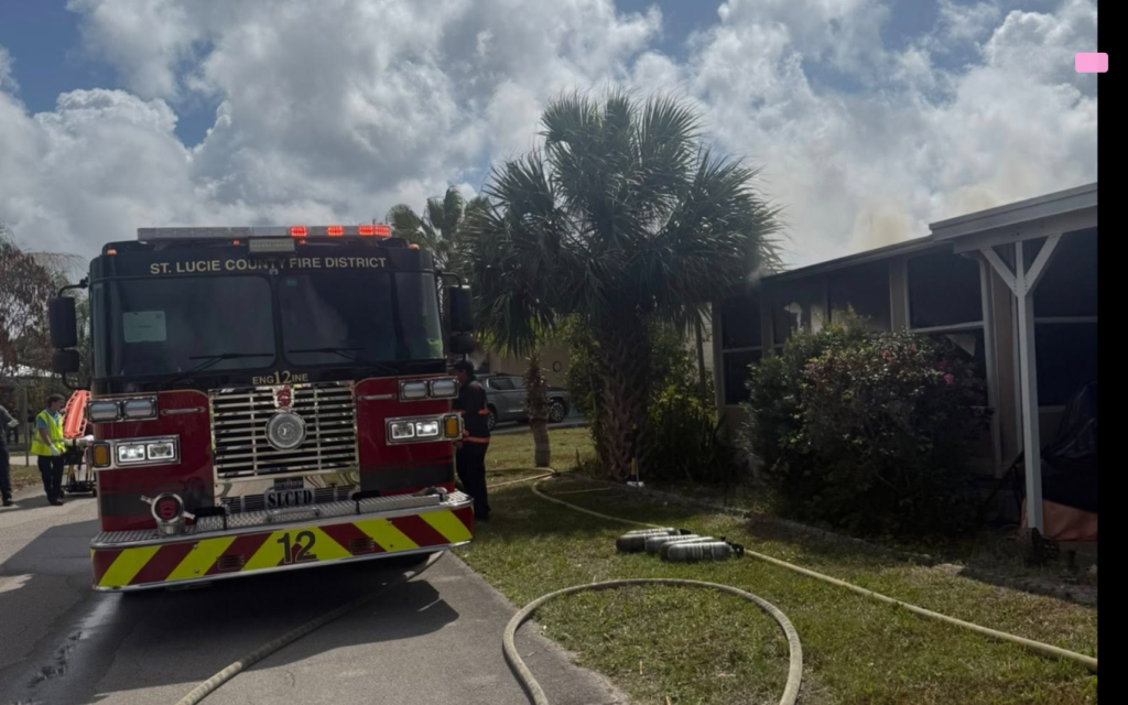 Firefighters battle wind-driven house fire in Port St Lucie Alhambra South neighborhood